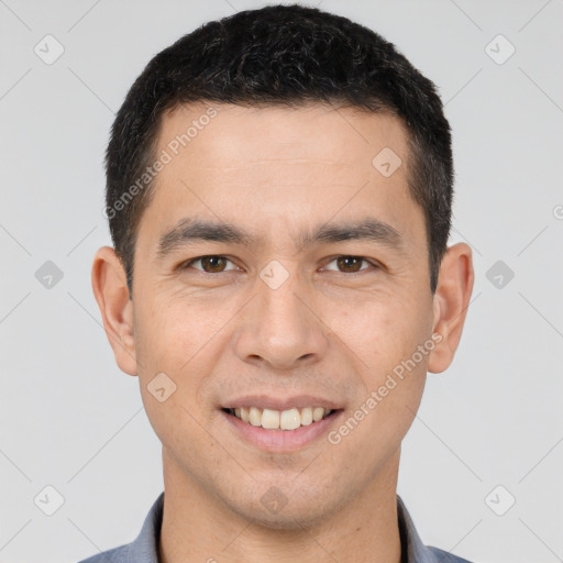 Joyful white young-adult male with short  black hair and brown eyes