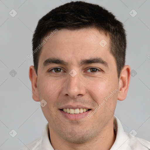 Joyful white young-adult male with short  brown hair and brown eyes