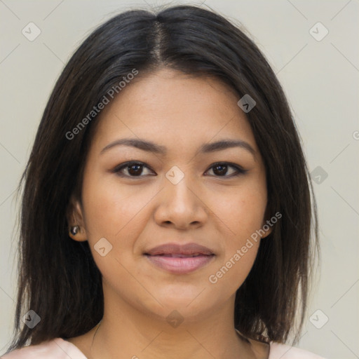 Joyful latino young-adult female with medium  brown hair and brown eyes