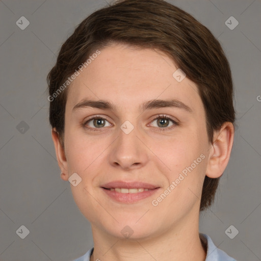 Joyful white young-adult female with short  brown hair and grey eyes