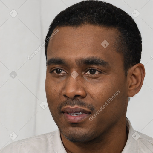 Neutral latino young-adult male with short  black hair and brown eyes