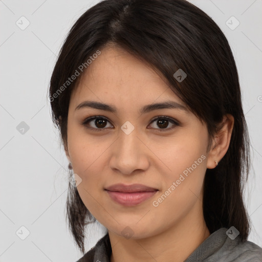 Joyful latino young-adult female with medium  brown hair and brown eyes