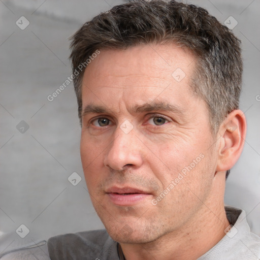 Neutral white adult male with short  brown hair and brown eyes