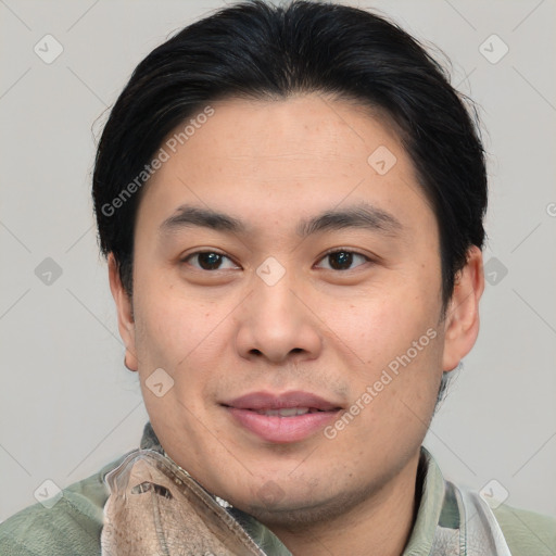 Joyful asian young-adult male with short  brown hair and brown eyes