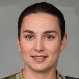 Joyful white young-adult female with short  brown hair and grey eyes