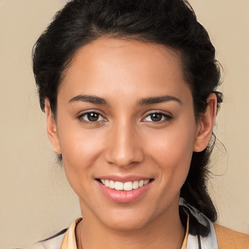 Joyful white young-adult female with long  brown hair and brown eyes