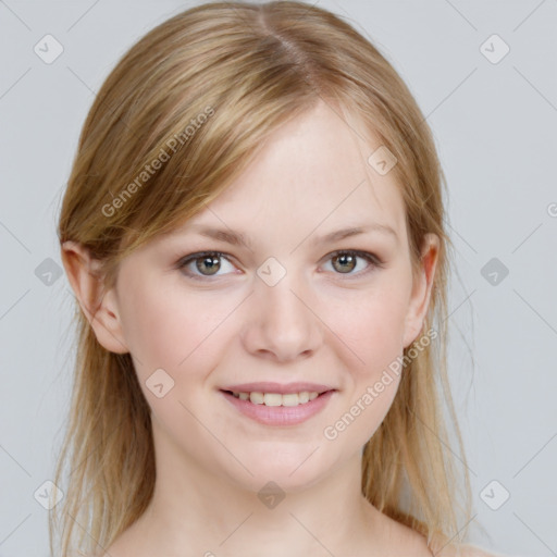 Joyful white young-adult female with medium  brown hair and blue eyes