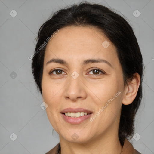 Joyful white adult female with medium  brown hair and brown eyes