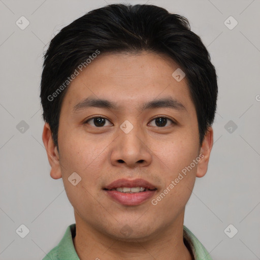 Joyful asian young-adult male with short  brown hair and brown eyes