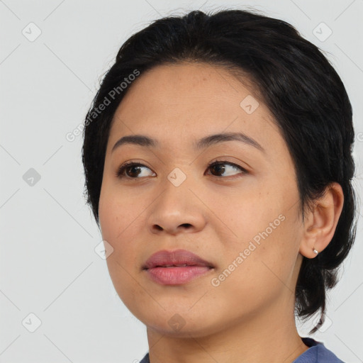 Joyful asian young-adult female with medium  black hair and brown eyes