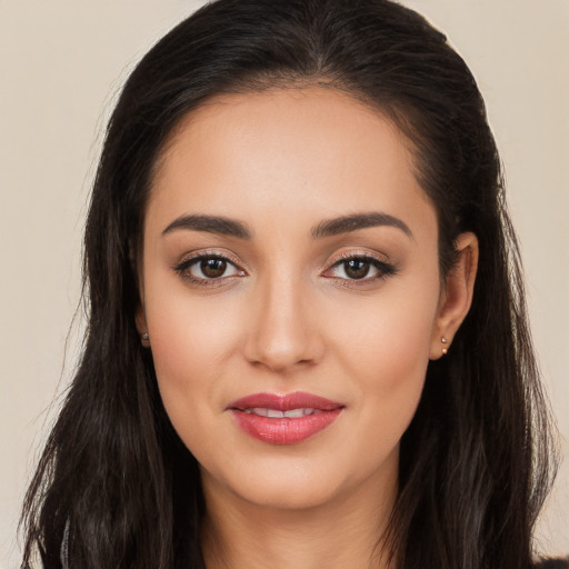 Joyful white young-adult female with long  brown hair and brown eyes