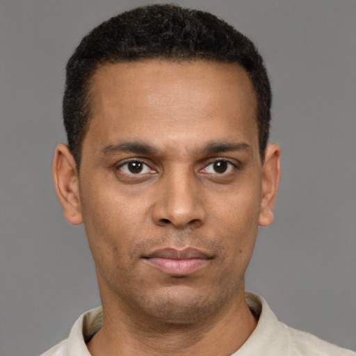Neutral black young-adult male with short  brown hair and brown eyes