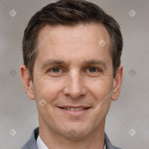 Joyful white adult male with short  brown hair and brown eyes