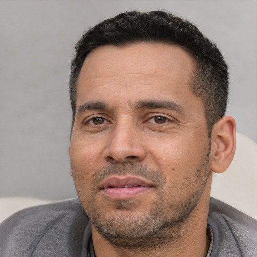 Neutral white adult male with short  black hair and brown eyes