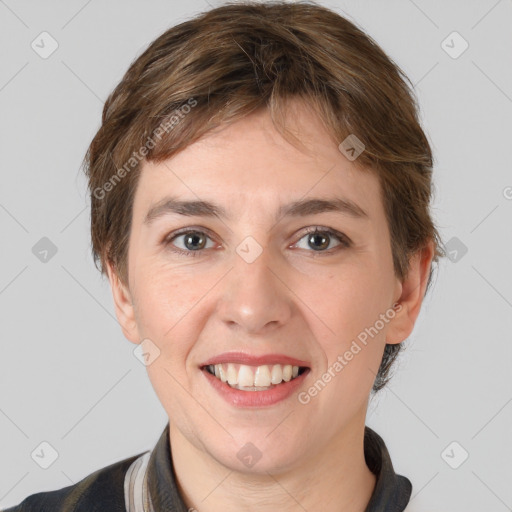 Joyful white young-adult female with short  brown hair and grey eyes