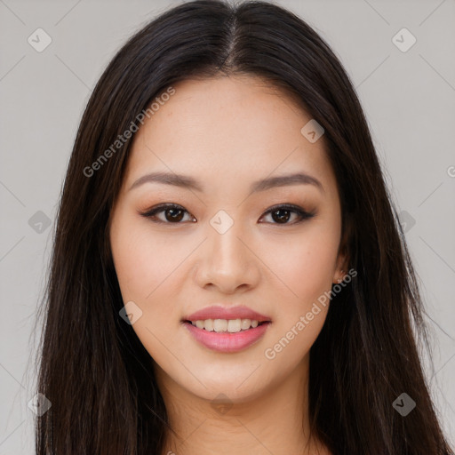 Joyful asian young-adult female with long  brown hair and brown eyes