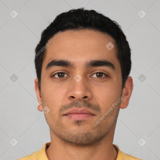 Neutral latino young-adult male with short  black hair and brown eyes