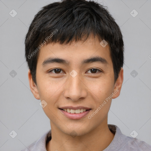 Joyful asian young-adult male with short  brown hair and brown eyes