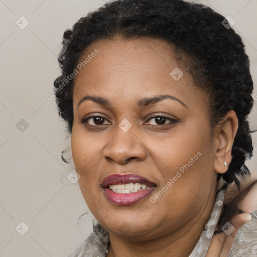 Joyful latino adult female with short  brown hair and brown eyes