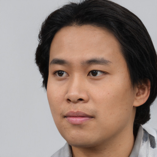 Neutral asian young-adult male with short  black hair and brown eyes