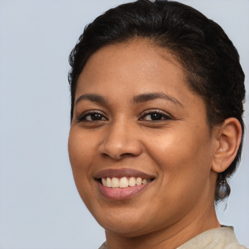 Joyful latino young-adult female with short  brown hair and brown eyes