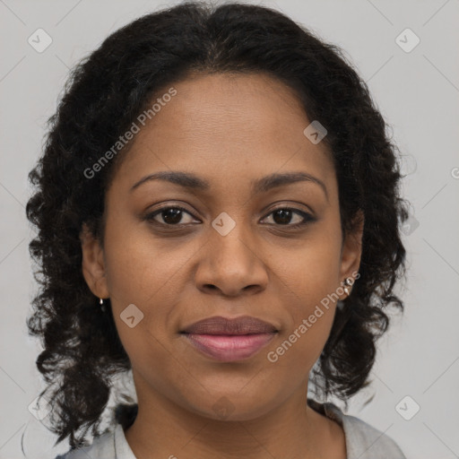 Joyful black adult female with medium  brown hair and brown eyes