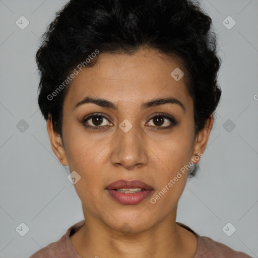 Joyful latino young-adult female with short  black hair and brown eyes