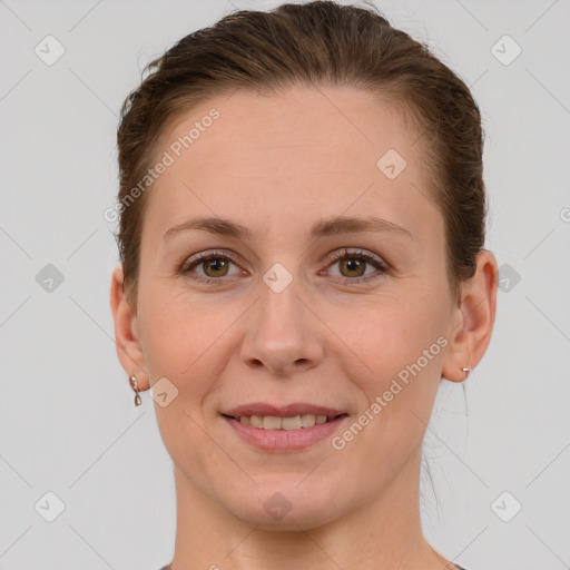 Joyful white adult female with short  brown hair and grey eyes