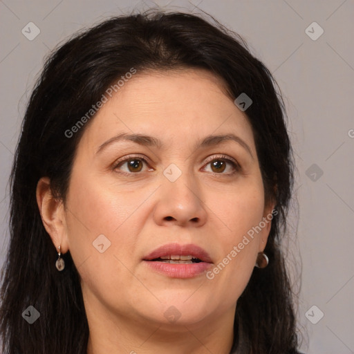 Joyful white adult female with long  brown hair and brown eyes