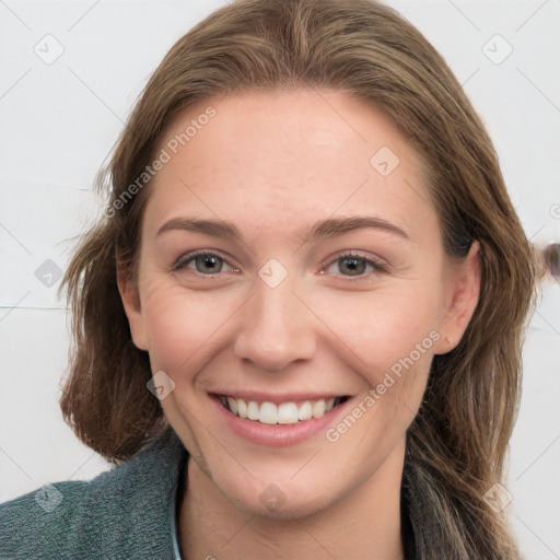 Joyful white young-adult female with long  brown hair and grey eyes