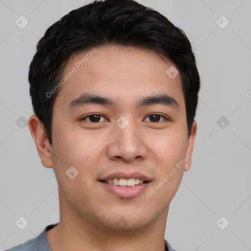 Joyful asian young-adult male with short  brown hair and brown eyes