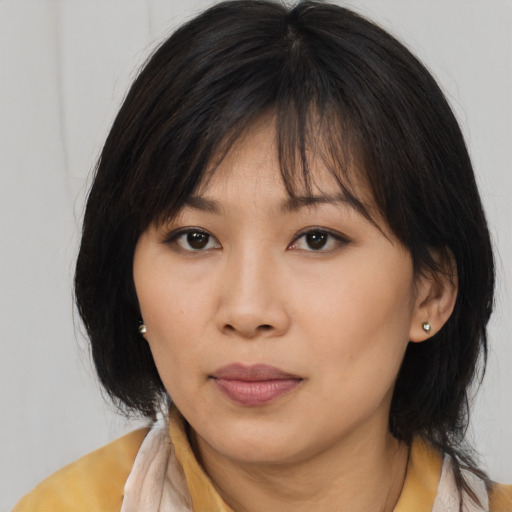 Neutral asian young-adult female with medium  brown hair and brown eyes