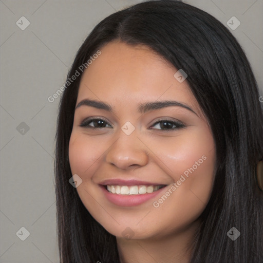 Joyful latino young-adult female with long  black hair and brown eyes