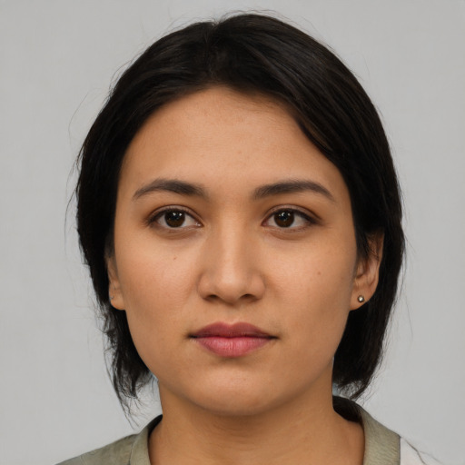 Neutral latino young-adult female with medium  black hair and brown eyes