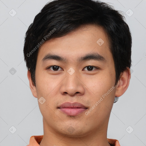 Joyful asian young-adult male with short  brown hair and brown eyes