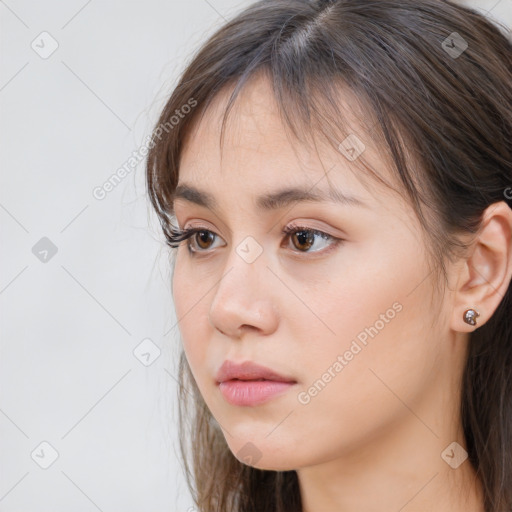 Neutral white young-adult female with long  brown hair and brown eyes