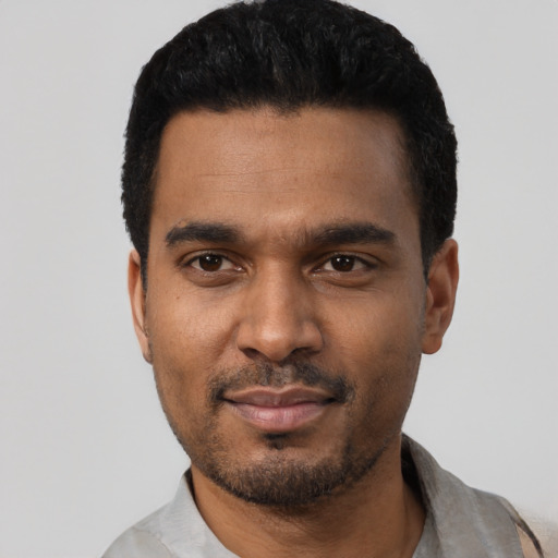 Neutral black young-adult male with short  black hair and brown eyes