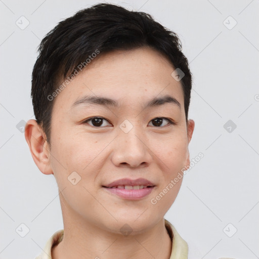 Joyful asian young-adult male with short  brown hair and brown eyes