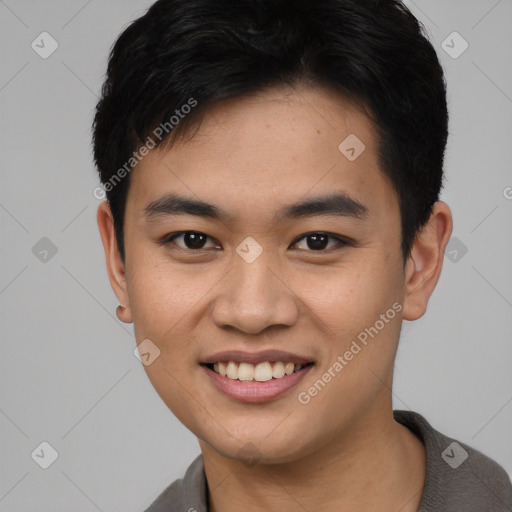 Joyful asian young-adult male with short  black hair and brown eyes