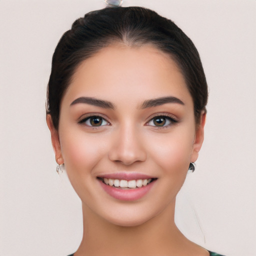 Joyful white young-adult female with medium  black hair and brown eyes