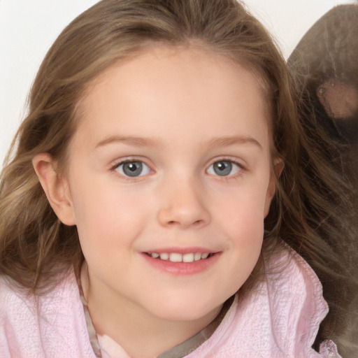 Joyful white child female with medium  brown hair and grey eyes