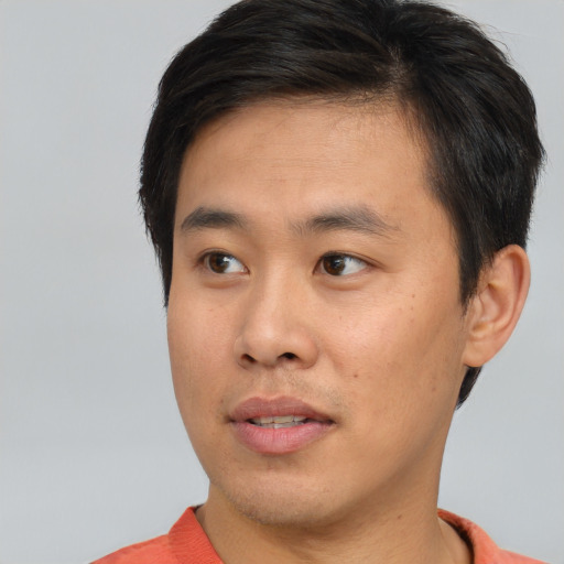 Neutral asian young-adult male with short  brown hair and brown eyes