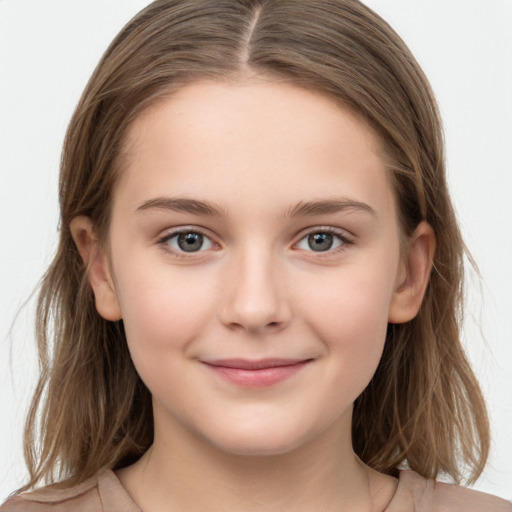 Joyful white child female with long  brown hair and brown eyes