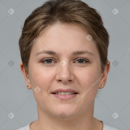 Joyful white young-adult female with short  brown hair and grey eyes