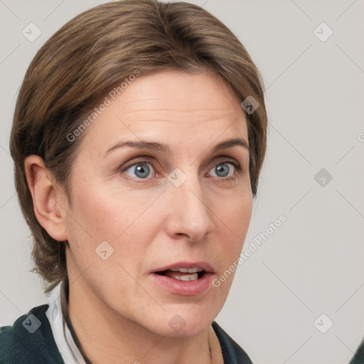 Joyful white adult female with medium  brown hair and grey eyes