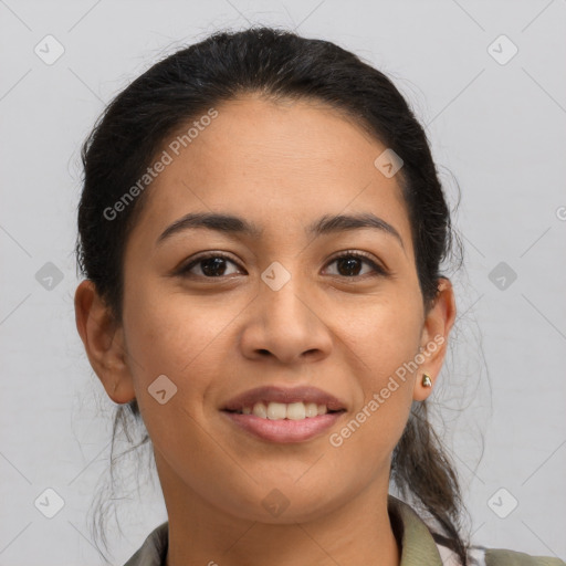 Joyful latino young-adult female with medium  brown hair and brown eyes