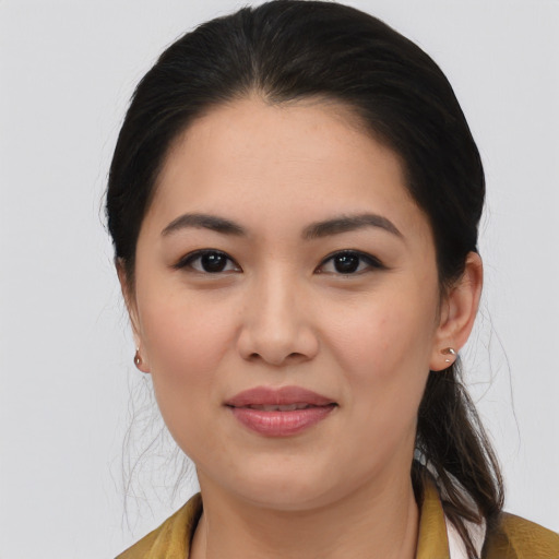 Joyful asian young-adult female with medium  brown hair and brown eyes