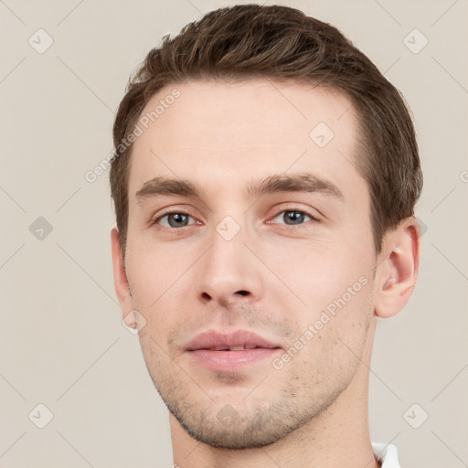 Neutral white young-adult male with short  brown hair and grey eyes