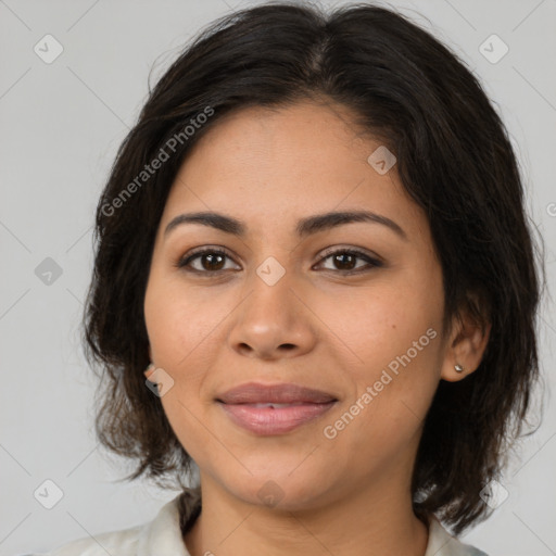 Joyful latino young-adult female with medium  brown hair and brown eyes