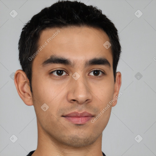 Joyful latino young-adult male with short  black hair and brown eyes